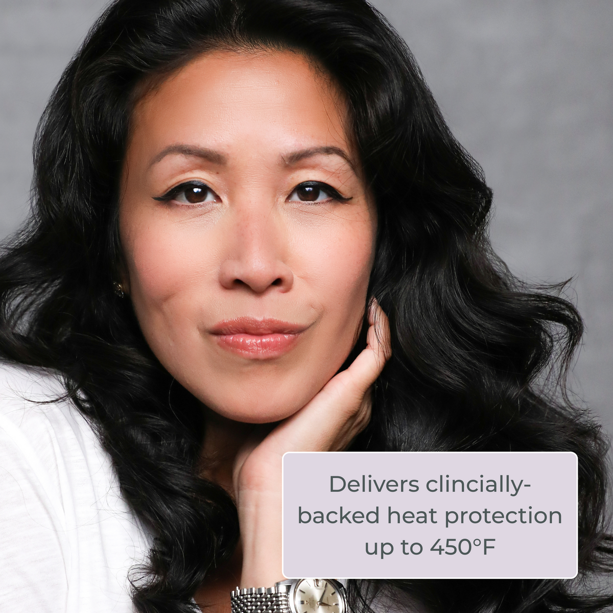 Woman with dark wavy hair: EVOLVh InstaVolume Volumizing Foam heat protection up to 450°F